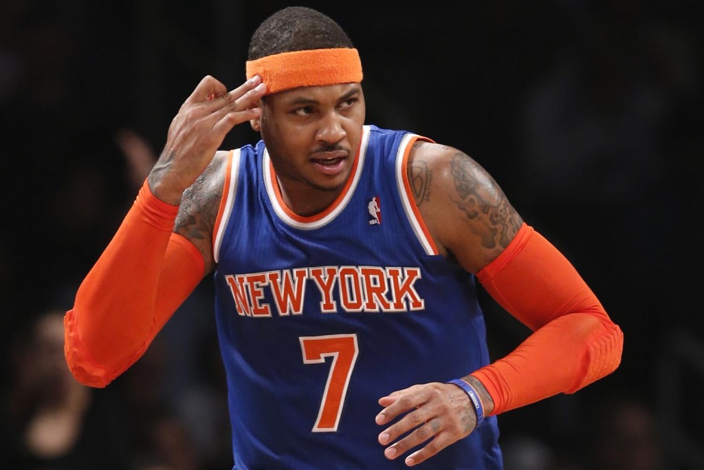 New York Knicks forward Carmelo Anthony (7) reacts after hitting a three point shot in the first half of the Knicks NBA basketball game Brooklyn Nets at the Barclays Center, Thursday, Dec. 5, 2013, in New York. Amthony scored 19 points i the Knicks 113-83 victory over the Nets. (AP Photo/Kathy Willens)